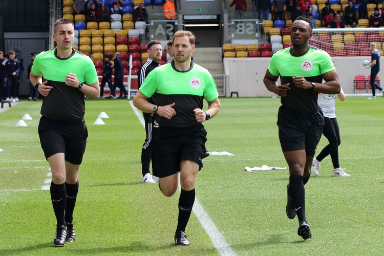 The match officials warm-up