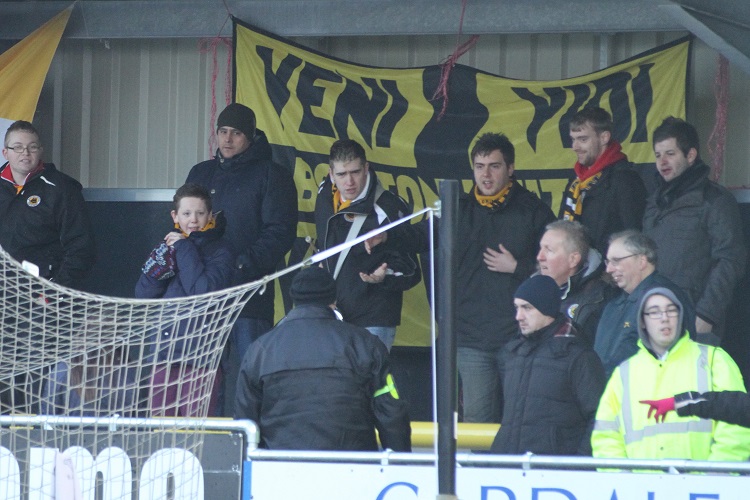 The Boston fans debate with a Harrogate steward