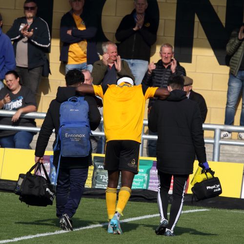 Femi Seriki helped off