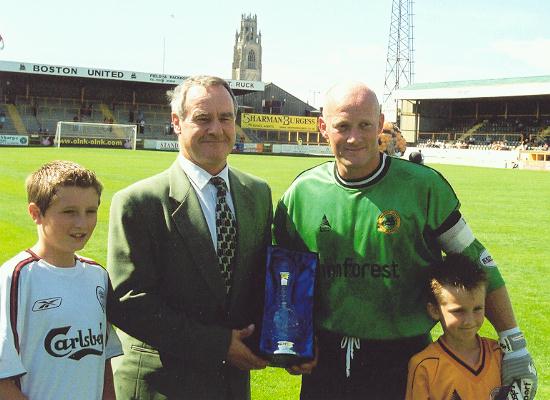 Paul Bastock gets award from Billy Howells
