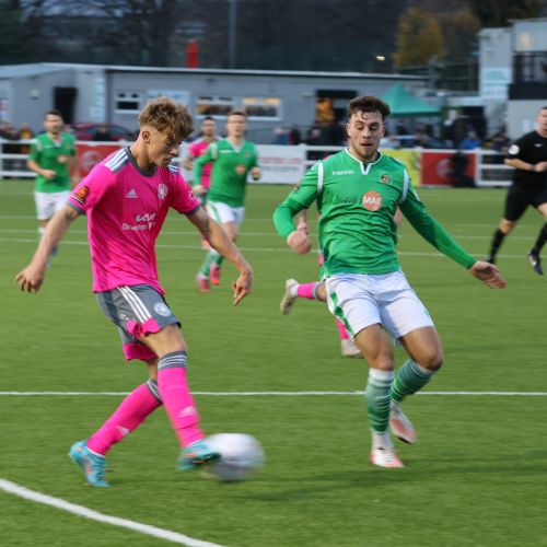 Sam McLintock crosses...