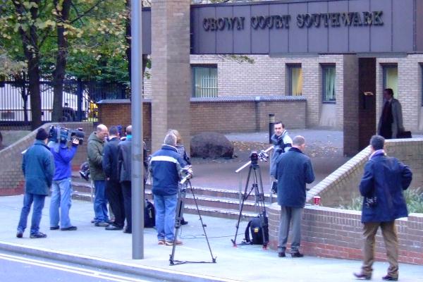 The press gather outside the court