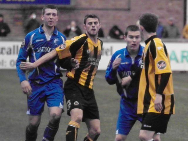 Liam Parker marks his man