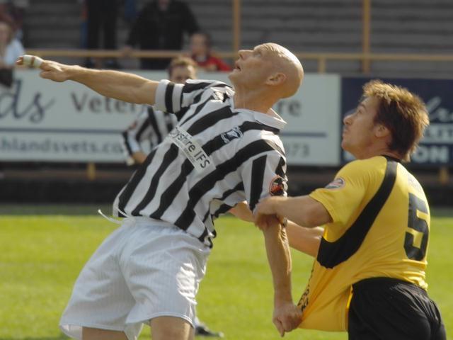 Former Pilgrim Neil Grayson tussles with Matt Bloomer