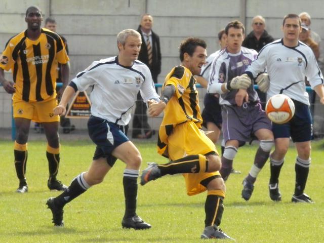 Jamie Clarke gets ahead of former Pilgrim Chris Holland