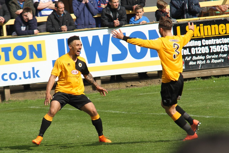 Jay Rollins celebrates the winner