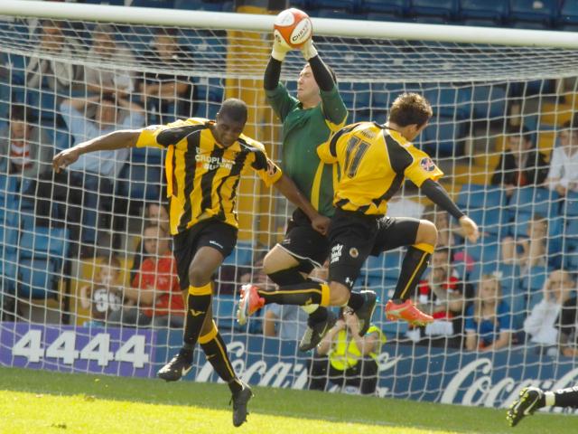 Danny Davidson and Jamie Clarke pressure the 'keeper
